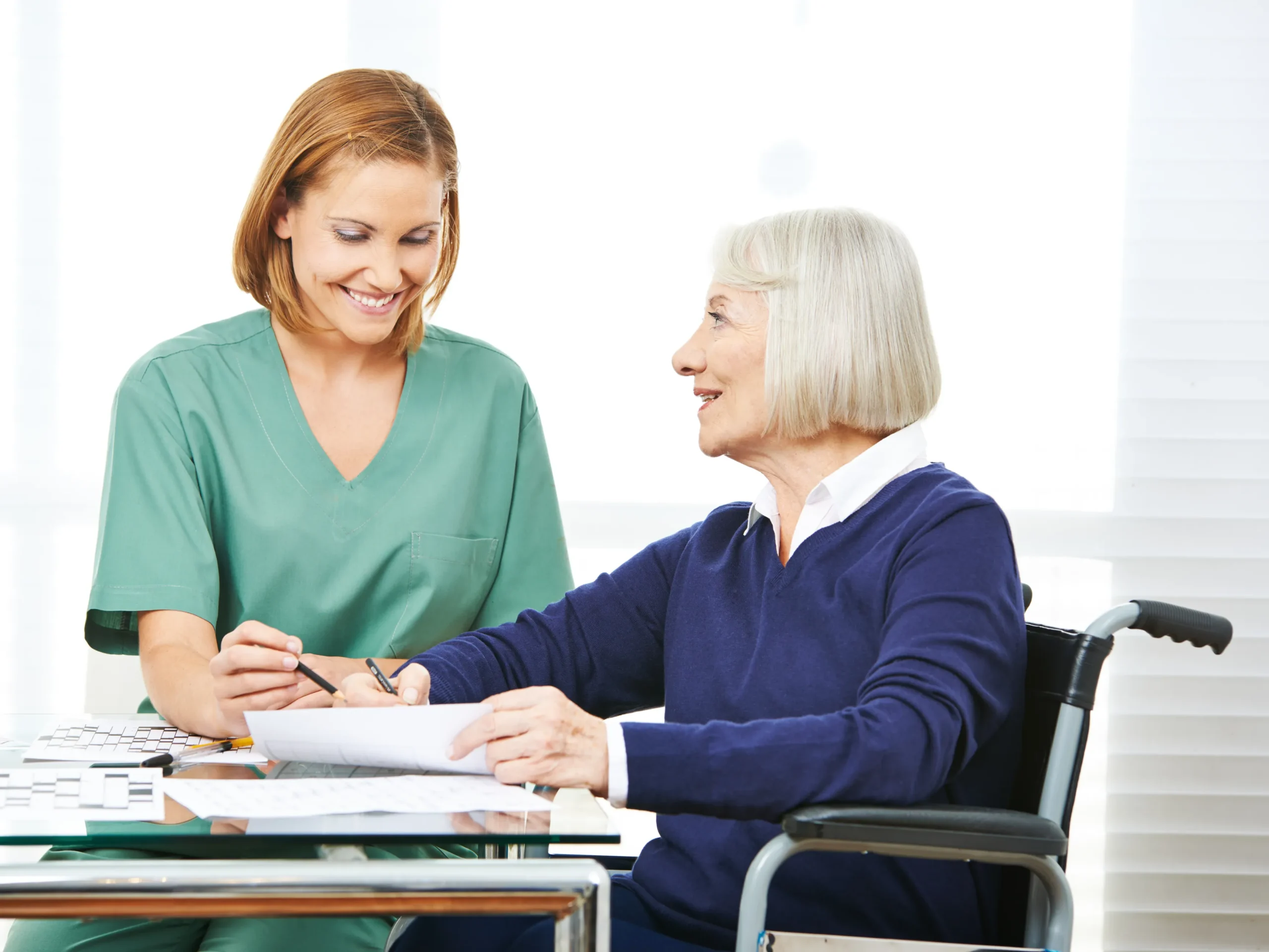 woman playing memory games with an elderly woman